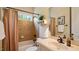 Well-maintained bathroom with tiled shower-tub combination and classic vanity at 101 Synandra Ln, Holly Springs, NC 27540
