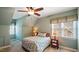 Cozy bedroom with sloped ceilings, carpet, and natural light at 101 Synandra Ln, Holly Springs, NC 27540