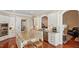Bright kitchen features custom cabinets, granite countertops, stainless steel appliances, and a functional center island at 101 Synandra Ln, Holly Springs, NC 27540