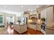 Gourmet kitchen with granite countertops, custom cabinetry, and stainless steel appliances at 101 Synandra Ln, Holly Springs, NC 27540