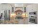 Modern kitchen with stainless steel appliances and custom cabinetry at 101 Synandra Ln, Holly Springs, NC 27540