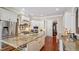 Well-appointed kitchen with a center island, granite countertops, and stainless appliances at 101 Synandra Ln, Holly Springs, NC 27540
