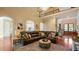 Open-concept living room with soaring ceilings, fireplace, and elegant chandelier at 101 Synandra Ln, Holly Springs, NC 27540