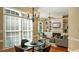 Inviting living room with a fireplace, built-in shelving, lots of natural light, and a cozy atmosphere at 101 Synandra Ln, Holly Springs, NC 27540
