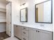 Bathroom featuring double sinks, granite counters, and a large walk-in closet at 1013 Coldspring Circle, Durham, NC 27705