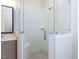 Bathroom showcasing a seamless glass shower with white tile and bench seating at 1013 Coldspring Circle, Durham, NC 27705