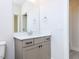 Well-lit bathroom featuring a vanity with storage and a sleek quartz countertop at 1013 Coldspring Circle, Durham, NC 27705