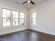 Bedroom features hardwood floors, recessed lighting, a ceiling fan, and bright natural light at 1013 Coldspring Circle, Durham, NC 27705