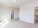 Spacious carpeted bedroom with ensuite bathroom and walk-in closet at 1013 Coldspring Circle, Durham, NC 27705