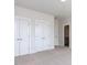 Bright, carpeted bedroom featuring double closets and an ensuite bathroom entrance at 1013 Coldspring Circle, Durham, NC 27705