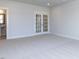 Bonus room features plush carpet, and french doors to the adjacent room at 1013 Coldspring Circle, Durham, NC 27705