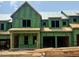 New construction featuring house wrap and wood framework, showcasing the early building stages at 1013 Coldspring Circle, Durham, NC 27705