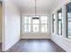 Inviting dining room featuring hardwood floors, large windows and a contemporary pendant light at 1013 Coldspring Circle, Durham, NC 27705