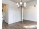 Dining room showcasing hardwood floors, bright lighting and wainscoting at 1013 Coldspring Circle, Durham, NC 27705