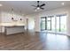 Open concept living space featuring hardwood floors, a kitchen island, and sliding glass doors at 1013 Coldspring Circle, Durham, NC 27705