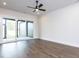 Open living area featuring hardwood floors, a ceiling fan and access to the outdoor space at 1013 Coldspring Circle, Durham, NC 27705