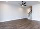 Spacious room featuring hardwood floors, a ceiling fan and stairs to the second level at 1013 Coldspring Circle, Durham, NC 27705