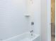 Contemporary shower with a tub, white subway tile, and a built-in shelf at 1013 Coldspring Circle, Durham, NC 27705