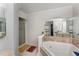 Bathroom featuring a large bathtub and separate shower at 103 Pony Express Cv, Louisburg, NC 27549
