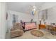 Cozy bedroom with neutral decor, ceiling fan, desk and comfortable chair at 103 Pony Express Cv, Louisburg, NC 27549