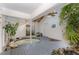 Relaxing indoor hot tub room with blue wood deck, tropical plants, and natural light at 103 Pony Express Cv, Louisburg, NC 27549
