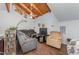 Comfortable living room featuring vaulted wood ceilings and a relaxing seating arrangement at 103 Pony Express Cv, Louisburg, NC 27549
