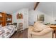 Upstairs living room featuring a comfortable couch and built-in bookshelves at 103 Pony Express Cv, Louisburg, NC 27549