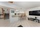 Inviting living room featuring an open floor plan, bar seating, and tiled floors at 103 Pony Express Cv, Louisburg, NC 27549