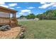 Backyard with a wooden deck and a view of a shed, and privacy fence at 105 Poplar Dr. Dr, Clayton, NC 27520