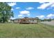 Spacious backyard featuring a wooden deck, privacy fence, and a well-maintained lawn at 105 Poplar Dr. Dr, Clayton, NC 27520