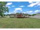 Spacious backyard featuring a wooden deck, privacy fence, and a well-maintained lawn at 105 Poplar Dr. Dr, Clayton, NC 27520