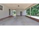 Carport featuring concrete floor, a back door, a storage door and concrete block walls at 105 Poplar Dr. Dr, Clayton, NC 27520