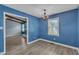 Dining room with stylish floors, plenty of natural light, and an open view into another living space at 105 Poplar Dr. Dr, Clayton, NC 27520