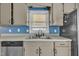 Kitchen featuring stainless steel appliances, painted cabinets, and ample counterspace at 105 Poplar Dr. Dr, Clayton, NC 27520