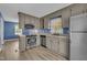 Functional kitchen featuring stainless steel appliances, ample cabinet space, and an adjacent dining area at 105 Poplar Dr. Dr, Clayton, NC 27520