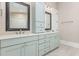Beautiful bathroom features double vanity sinks, custom mirrors and storage at 1131 Lowland St, Apex, NC 27523