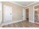 This bedroom features a modern door and access to a bright bathroom at 1131 Lowland St, Apex, NC 27523