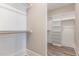 Walk-in closet offering ample shelving and space for optimal organization at 1131 Lowland St, Apex, NC 27523