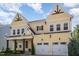 Charming two-story home with a well-manicured lawn, covered porch, and a convenient two-car garage at 1131 Lowland St, Apex, NC 27523