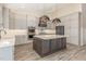 Spacious kitchen features a center island, stainless appliances, and custom cabinets at 1131 Lowland St, Apex, NC 27523
