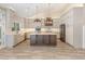 This kitchen features a large island, stainless appliances, and custom cabinets at 1131 Lowland St, Apex, NC 27523