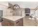 Open floor plan showcasing the gourmet kitchen, island and the living room fireplace at 1131 Lowland St, Apex, NC 27523