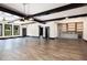 Wide open living room with accent lighting, wood floors, and a bar area at 1131 Lowland St, Apex, NC 27523