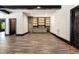 This living room includes custom cabinets, lighting, and wood-look floors at 1131 Lowland St, Apex, NC 27523