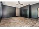 Room with dark painted walls, wood floor and two doors at 1131 Lowland St, Apex, NC 27523