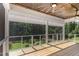 Spacious porch with wooden floorboards, a ceiling fan, and retractable screen for enjoying scenic views at 1131 Lowland St, Apex, NC 27523