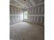 Unfinished bedroom with drywall and a window offering natural light at 115 Mildred Place, Broadway, NC 27505