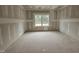 Bright bedroom space with large windows and recessed ceiling at 115 Mildred Place, Broadway, NC 27505