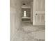 Spacious, unfinished hallway bathed in natural light from the exterior door at 115 Mildred Place, Broadway, NC 27505