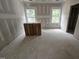 Large unfinished living room space with large windows at 115 Mildred Place, Broadway, NC 27505